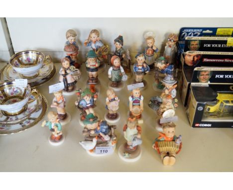 Twenty assorted Goebal Hummel figurines.