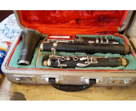 A cased H Singhai vintage clarinet.