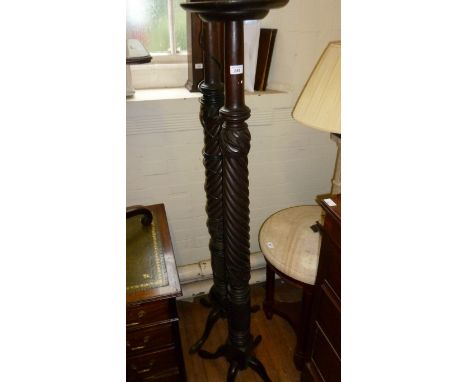 A early 20th Century torchere raised on barley twist together with a similar standard lamp (sold electrically untested)
