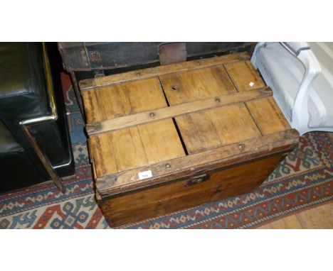 A vintage pine storage trunk.