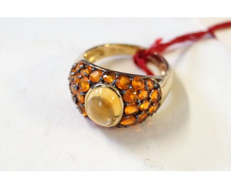 A 9ct gold gem-set ringSet with fire opals and a 'jelly-bean' opal, weight 4.2g