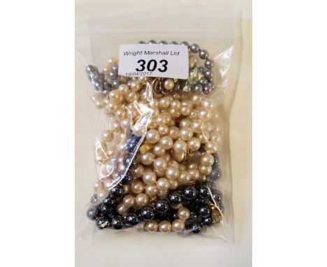 A hematite bead necklaceTogether with; three cultured pearl necklaces to gold clasps and a pearl bracelet (5)