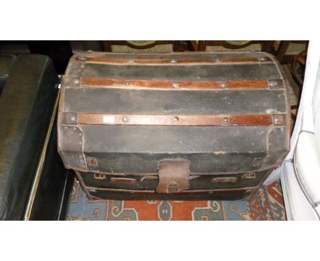 A vintage wooden bound storage trunk
