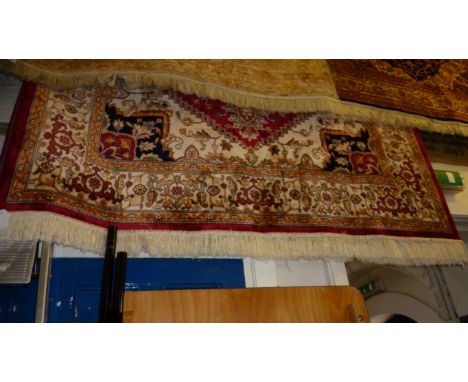 A heriz carpet on a red ground, approx 2.3x1.6m.