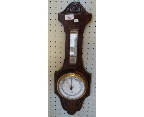 A oak cased aneroid barometer 