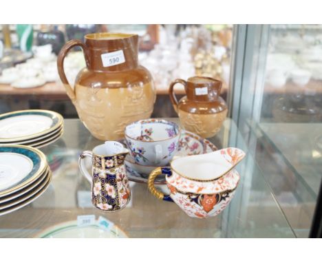 A mixed group of ceramic items to include a Spode Imari pattern trio, two Royal Crown Derby jugs, and two Doulton Lambeth rel