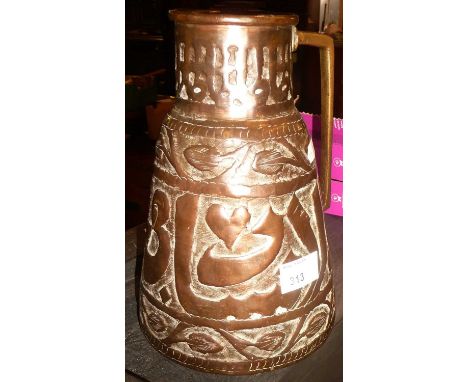 Islamic beaten copper pitcher with brass handle, 24cm