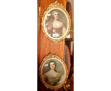 Pair of gilt oval framed colour portrait prints of ladies