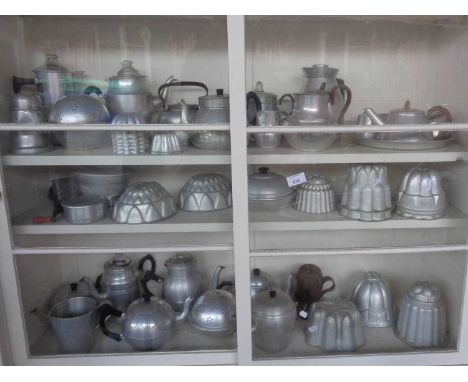 Large collection of aluminium kitchenalia, inc. jelly moulds, percolators and teapots etc.