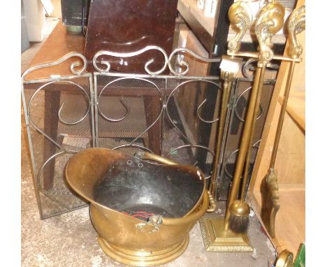 Edwardian brass fire irons on stand having ball and claw handles, a brass coal scuttle and a steel three-fold firescreen