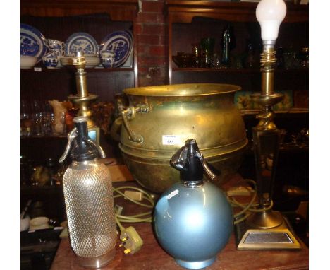Brass "cauldron" coal or log box on tripod legs, two table lamps and two soda syphons