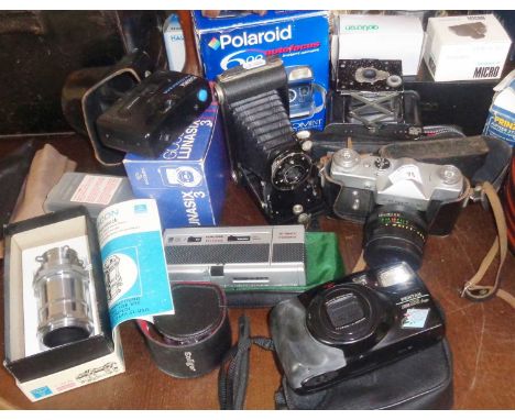 Assorted cameras (7) and accessories, inc. Pentax Zoom 105, Halina telewide and Kodak bellows, etc.