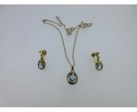 the oval cut light blue spinel collet set in a plain mount, tapered bale, Birmingham hallmarks for 9ct gold 1968, length with