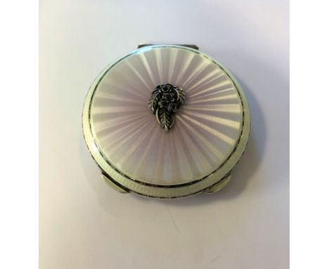 by Henry Clifford Davis, Birmingham 1962, of circular form, the hinged cover decorated with a starburst of pearlescent pink g
