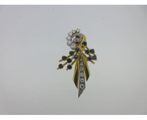 designed as a loose looped tie of polished and gem set threads and ribbons, set with round brilliant and single cut diamonds 
