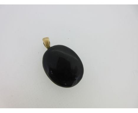 the plain oval locket with uniform black enamel on both sides, interior with both sides vacant, one glazed, integral tapered 