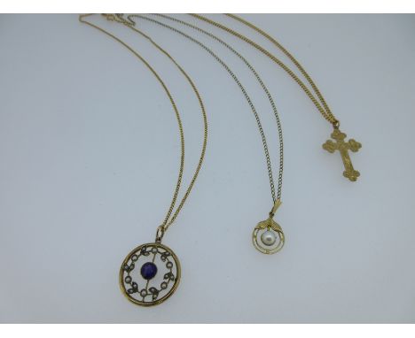 the first annular with a wreath of seed pearl set leaves inside the outer ring and in the centre a round cut amethyst on a kn