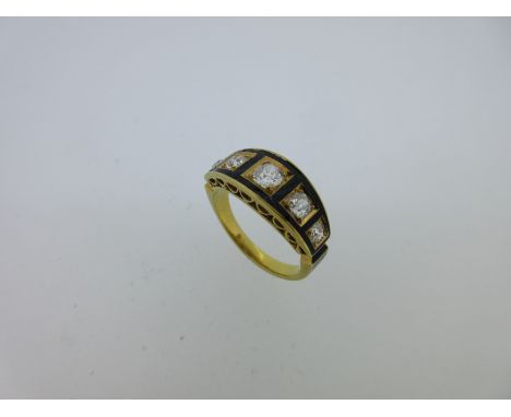 the five old cushion cut diamonds claw set in recessed squares with black enamel framing forming a tapered band, the cinched 