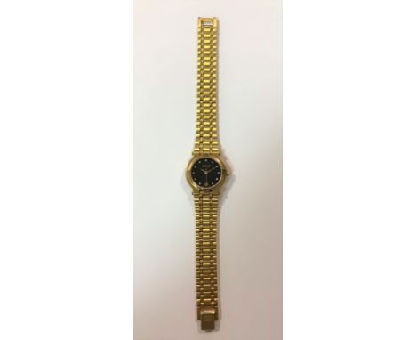 c1985, model 9200L, the signed black dial, 18mm diameter, with gold coloured hands and centre sweep, diamond points, date win