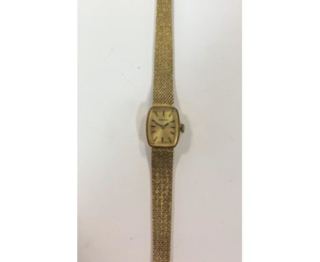 c1973, the signed rectangular champagne dial, 12mm diameter, with black batons and hands, signed 17 jewel mechanical crown wi