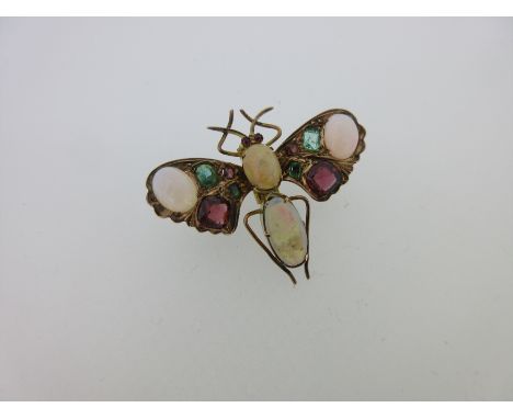 the thorax, abdomen and upper wingtips set with oval cabochon opals, all with good play of colour, the three largest predomin