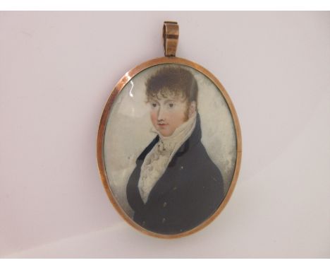 the oval half length portrait of a young man, with curly chestnut hair, clean shaven apart from long sideburns, dressed in th