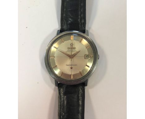 c1963, model 168-004, the signed silvered 'pie pan' dial, 30mm diameter, with gold coloured batons, hands and centre sweep, d