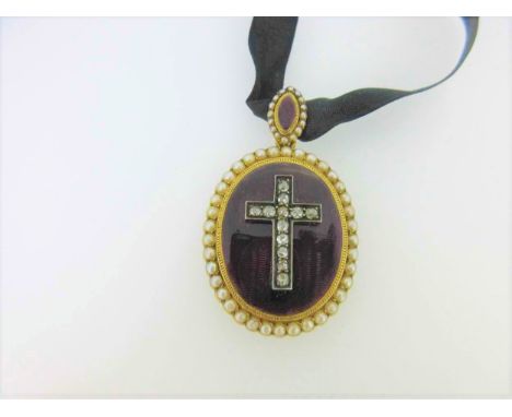 the Latin cross set with old mainly oval and cushion cut diamonds set in white metal above an oval ground of maroon guilloche