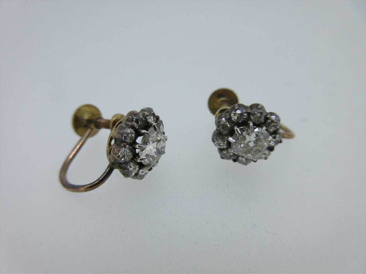 A pair of diamond cluster screw back earrings, in Cheffins Fine Art