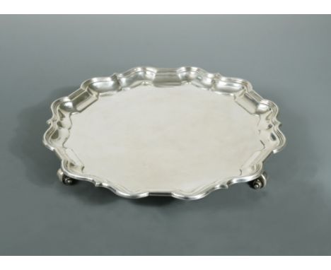 by Mappin &amp; Webb, Sheffield 1922, ‘Chippendale’ style with reeded rim and raised on four scroll feet, signed to the under
