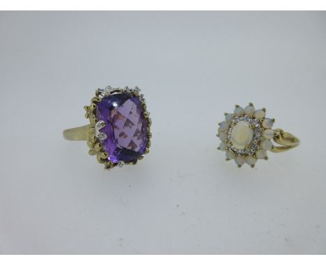 the first with a cushion shaped chequerboard faceted amethyst, held in place by an asymmetric chain of flowers around its sid