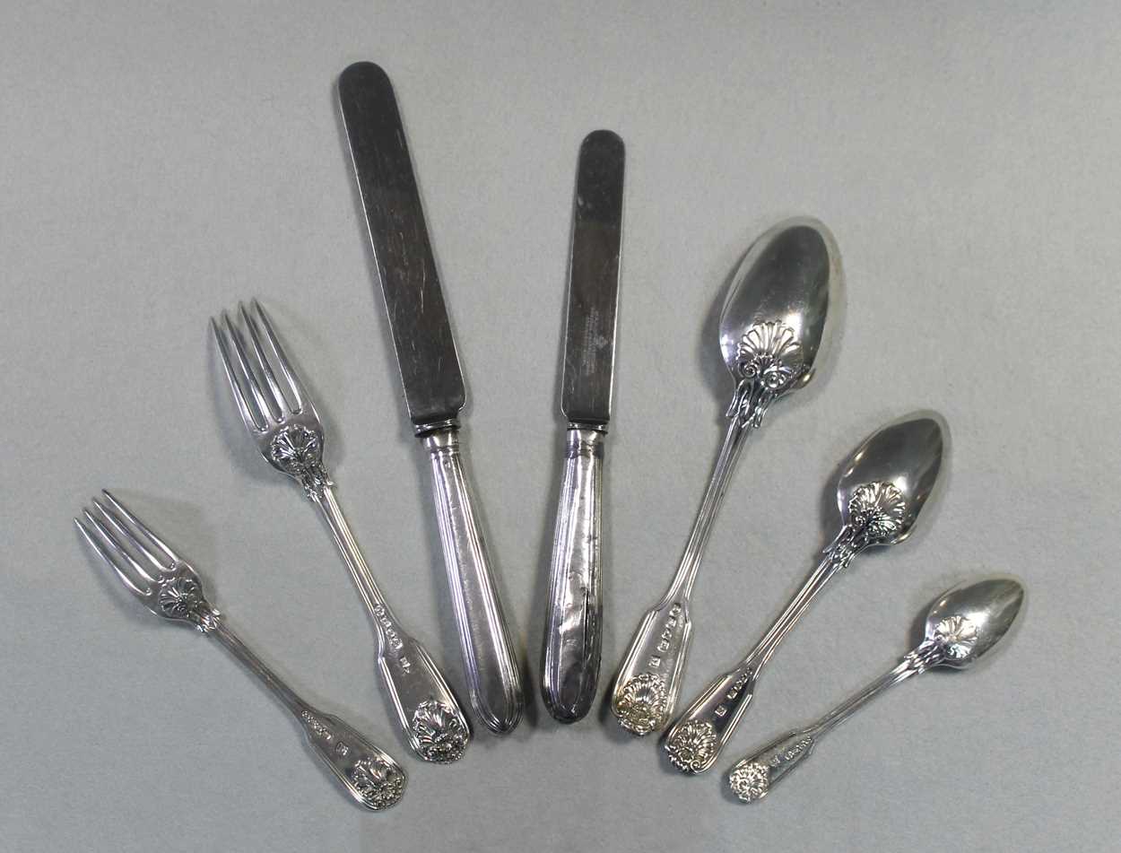 A 34 piece set of Victorian silver flatware with 13 additions, in