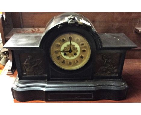 An old slate mantle clock.