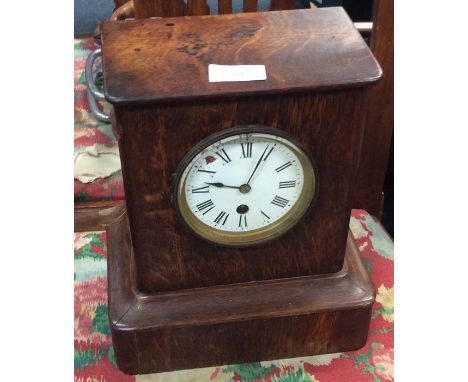 A small oak mantle clock.
