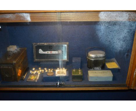 Contents of Cabinet To Included Assorted WWII Artifacts; Ammunition Tins, Bayonet Scabbard, Assorted Buttons, Focker Wolf 190