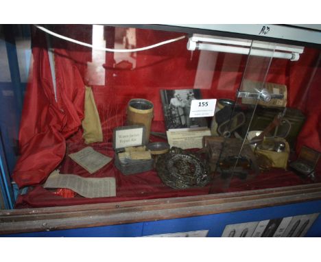 Contents of Showcase to Include Brass Plaque, Gas Mask, Ammunition Box, Gas Eye Shields, Compass and a First Aid Kit, etc. 
