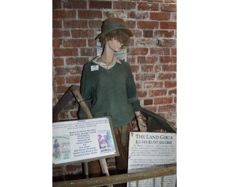 Female Mannequin Depicting a Land Girl with Scythe 
