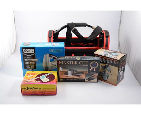 TOOL CADDY containing MAC JIG SAW, BASIC SPRAY GUN SET, MASTER CUT TOOL and SWIVEL VISE.