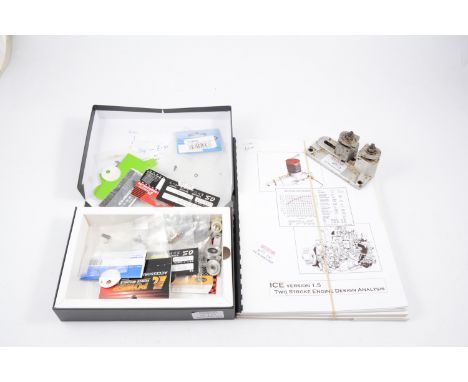 3 items: DC test stand, box of engine spares; and four model books.