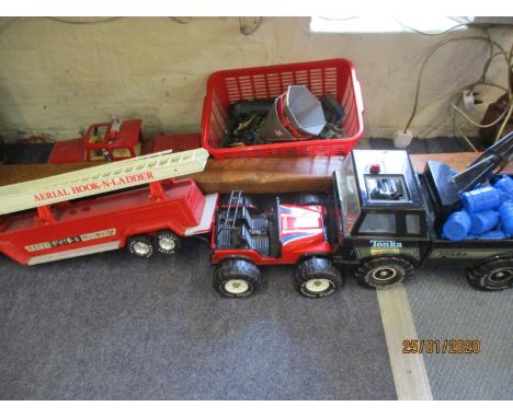 A Tonka pick up truck, a Tonka buggy, a fire engine, toy soldiers, cars and fire truck 