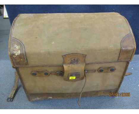 An early 20th century brown canvas and leather arched top trunk with an impressed Royal Warrant 