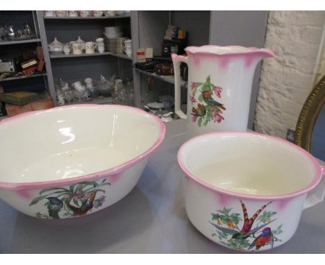 A New Hall early 20th century jug and bowl set with matching chamber pot having a white ground with hummingbird design 