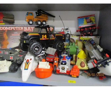 Circa 1980s toys to include two Tonka trucks, an MB Battleship computer game, a child's movie projector and toy vehicles 