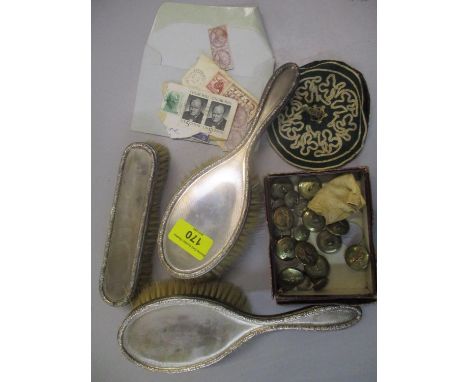 A set of three silver backed dressing table set items with engine turned decoration, RAF buttons, coins and stamps 