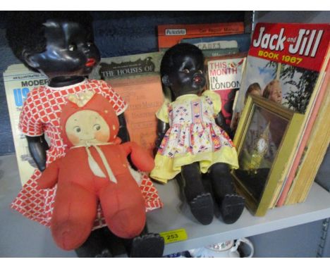 A mixed lot comprising of two pedigree dolls and 1930s Rose O'Neill Kewpie fabric doll, together with military factual books,