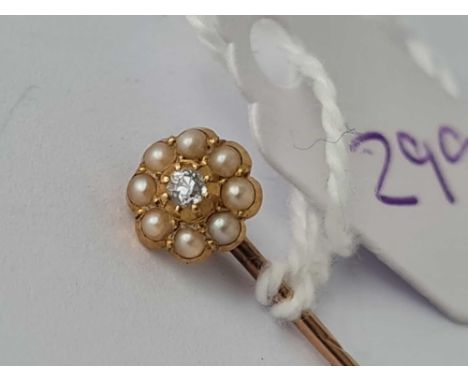 A pearl and diamond stick pin 15ct gold