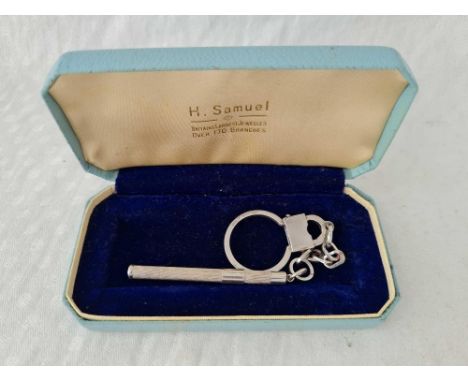A silver mounted key ring with tooth pick