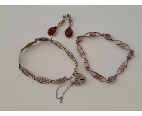 Two silver bracelets and a pair of earrings  