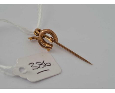 A horse shoe stick pin 9ct    1.3 gms