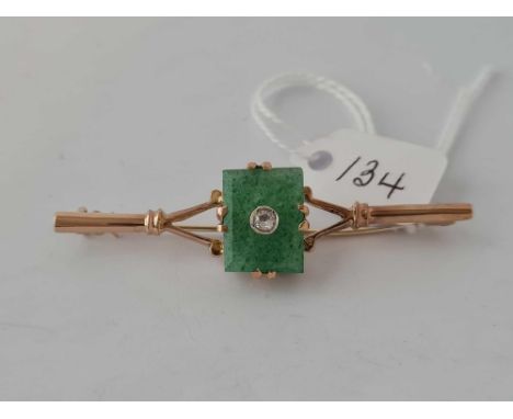 A 1920s jade oriental bar brooch with centre diamond feature 9ct      5.8 gms
